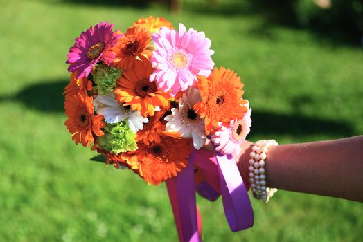 beautiful wedding flowers in a decorated garden in the background