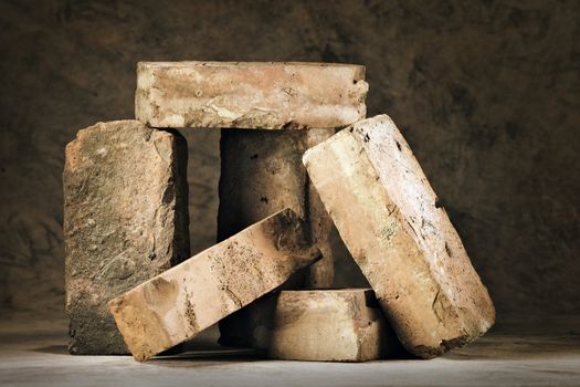 Still life with old and used worn bricks.