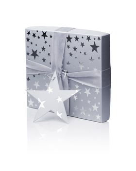 A Gift box (containing a CD) isolated on white with natural reflection.