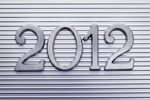 Number 2012 in small metallic letters.