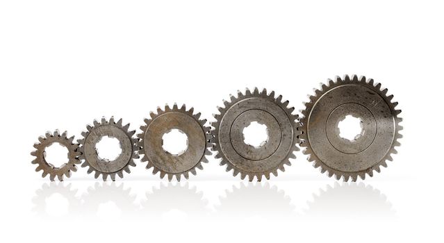 Different sizes of old metallic cog wheels.