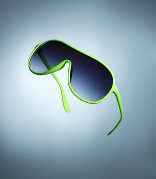 Cheap green 1980s style plastic sunglasses on blue background.