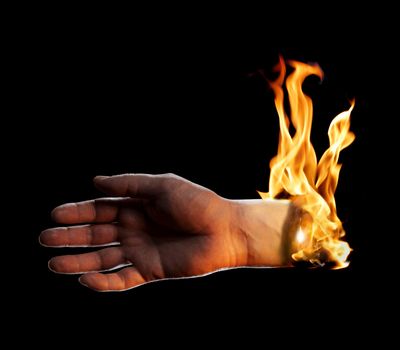 A Burning hand on black background.