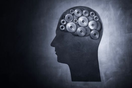 Conceptual image of head filled with cog gears.