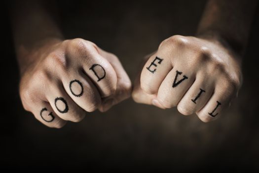 Man with "Good" and "Evil" fake tattoos.