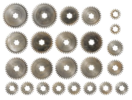 Old used steel cog gears isolated on white.