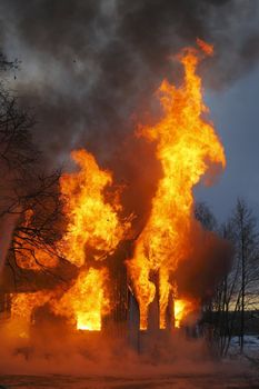 A Wooden house in flames