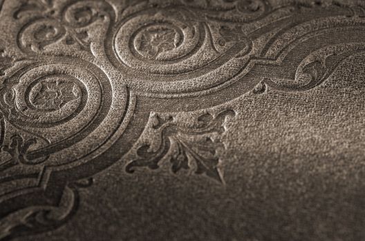 Sepia toned detail of an old book cover (Nya Illustrerade Magazin, printed in 1866)