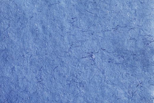 Background texture of blue hand-made paper.