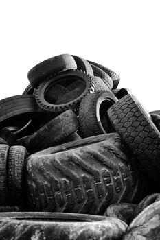 Black and white image of a Heap of old used tires.