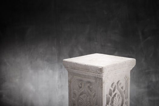 A Plaster column with nothing on top.