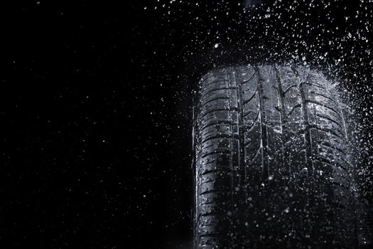 New car tire in rain.