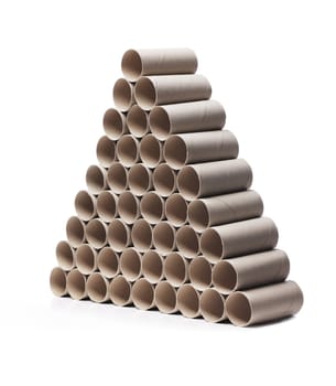 Used toilet paper cardboard rolls stacked in a triangular fashion.