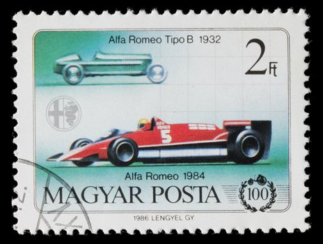 Hungary - Circa 1986: Hungarian commemorative stamp celebrating 100 years of the automobile. Alfa Romeo Tipo B and Alfa Romeo racing car. circa 1986 in Hungary