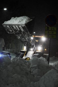 A Frontloader in snow storm in Finland.