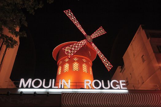 PARIS, FRANCE - MAY 17: Red windmill of famous nightclub Moulin Rouge May 17, 2010 in Paris, France