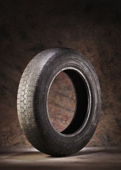 Old, worn and dirty car tire.