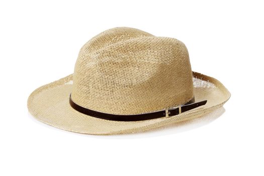 A Cheap summer hat made of straw on white background with natural reflection.