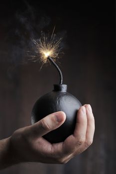 Man holding a bomb in his hand