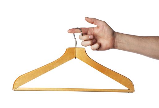 Old wooden clothes hanger hanging from a finger