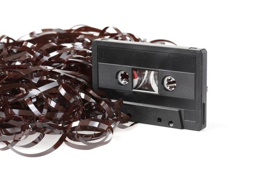 Old audio cassette with a heap of tangled tape