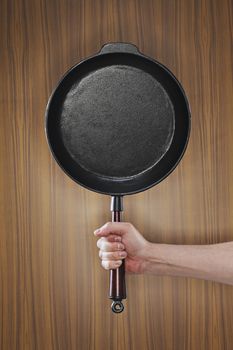 An old-fashioned cast iron frying pan