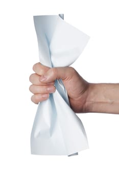 Hand of a man crushing a light blue paper.