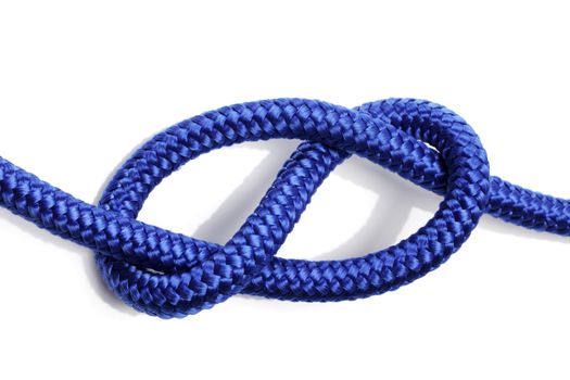 Figure-eight knot made with blue rope on white background.