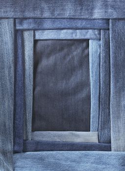 A frame made of different shades of blue denim