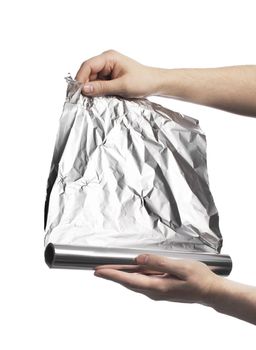 Man holding a roll of household aluminum foil