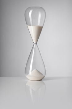 A Hourglass on reflective background.