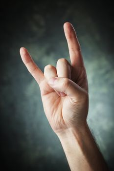 A Hand making a Sign of the horns aka devil sign aka maloik