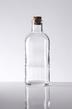 Old fashioned glass bottle with a cork stopper