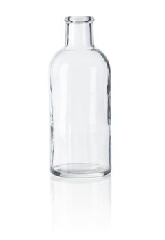 Old-fashioned glass bottle on white reflective background