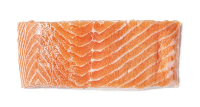 A Piece of raw salmon fillet on white