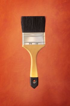 Paint brush on red background