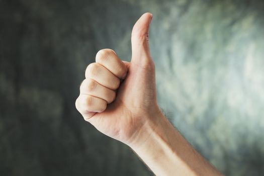 Man doing a Thumb up hand gesture