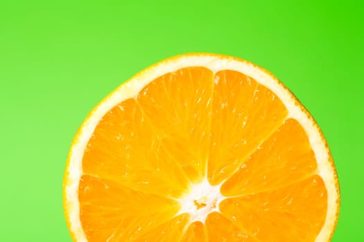 A half orange on green surface