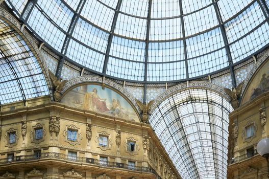 The Galleria Vittorio Emanuele II is a covered double arcade formed of two glass-vaulted arcades at right angles intersecting in an octagon, prominently sited on the northern side of the Piazza del Duomo  in Milan