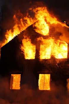 An old Wooden house burning