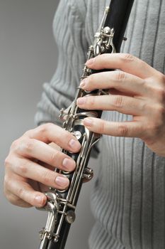 Man playing wood wind instrument clarinet