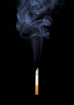 A Burning cigarette on black background