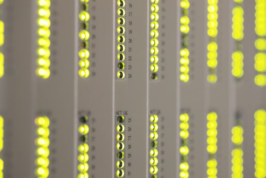 Blinking green leds in a server room, short depth of field