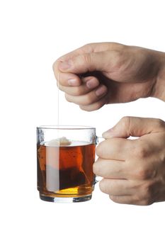 Teabag in a transparent glass tea mug with hot water