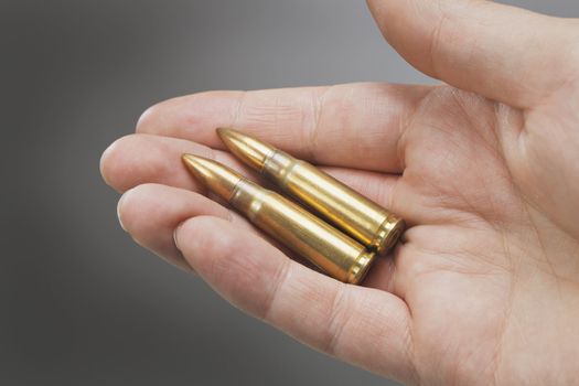 Assault rifle ammunition cartridges on a hand