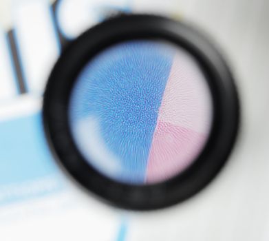 Stochastic offset printing raster seen trough a loupe.