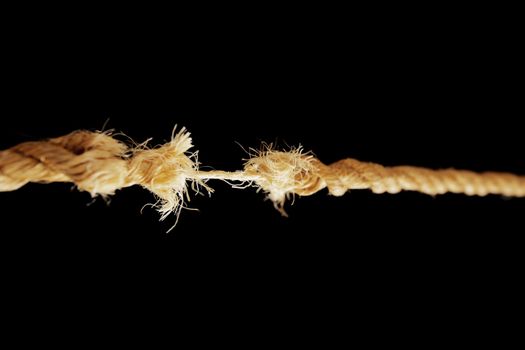 Breaking rope made of natural fibers. Short depth-of-field.