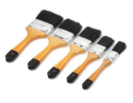 Different sized paint brushes isolated on white