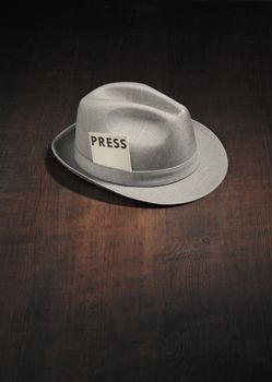 Vintage trilby hat with a press card