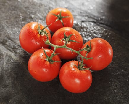 Ripe red tomatoes on stone